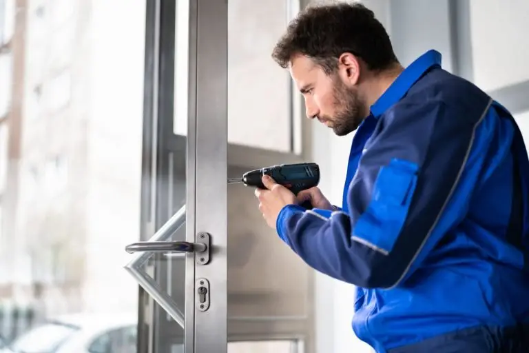 A commercial locksmith fixes a jammed lock