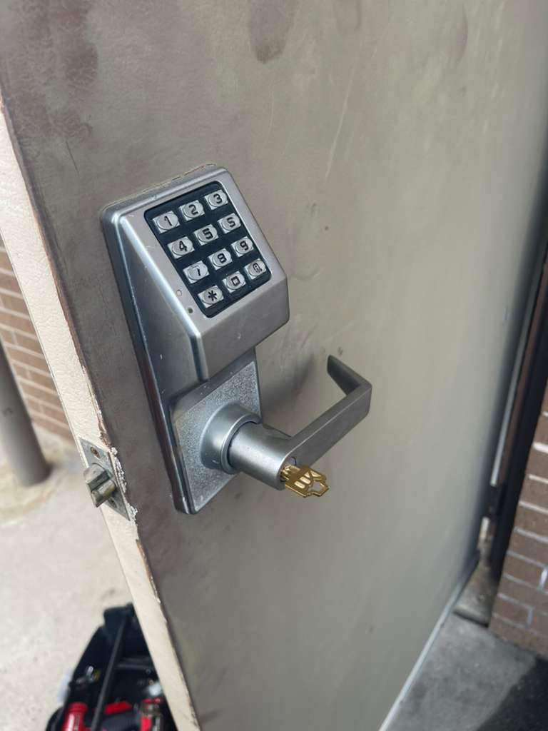 smart lock and backup entry setup shown in a real service photo